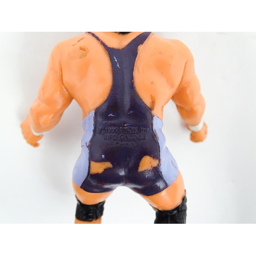 1276 - Toys: A 20thC WWF Wrestlemania wrestling ring, with Titan Sport American wrestler action figures to ... 