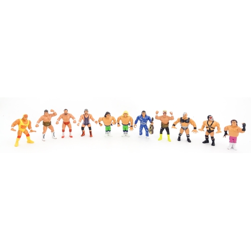 1276 - Toys: A 20thC WWF Wrestlemania wrestling ring, with Titan Sport American wrestler action figures to ... 