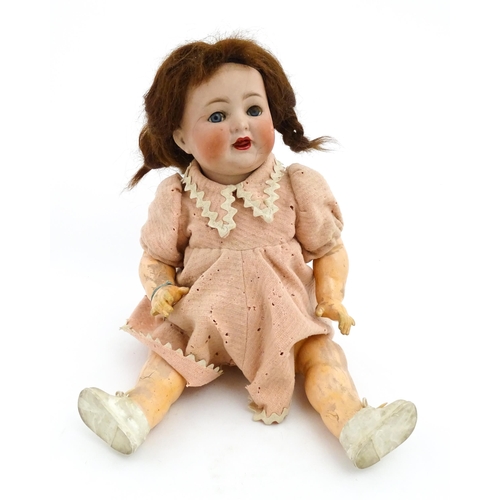 1279 - Toy: A 20thC Simon & Halbig doll, with bisque head numbered 126 having blue eyes and painted highlig... 