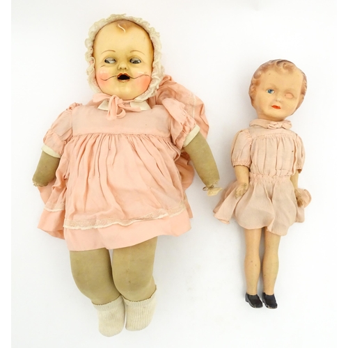 1280 - Toys: A 20thC Raynal doll with rhodoid head and cloth body. Together with a 20thC composite doll. La... 