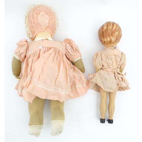 1280 - Toys: A 20thC Raynal doll with rhodoid head and cloth body. Together with a 20thC composite doll. La... 