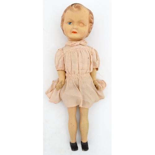 1280 - Toys: A 20thC Raynal doll with rhodoid head and cloth body. Together with a 20thC composite doll. La... 