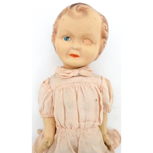 1280 - Toys: A 20thC Raynal doll with rhodoid head and cloth body. Together with a 20thC composite doll. La... 