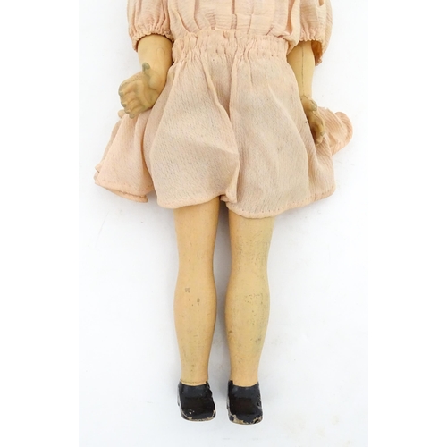 1280 - Toys: A 20thC Raynal doll with rhodoid head and cloth body. Together with a 20thC composite doll. La... 