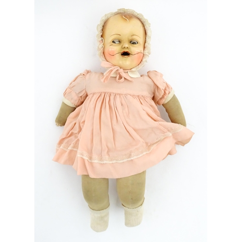 1280 - Toys: A 20thC Raynal doll with rhodoid head and cloth body. Together with a 20thC composite doll. La... 