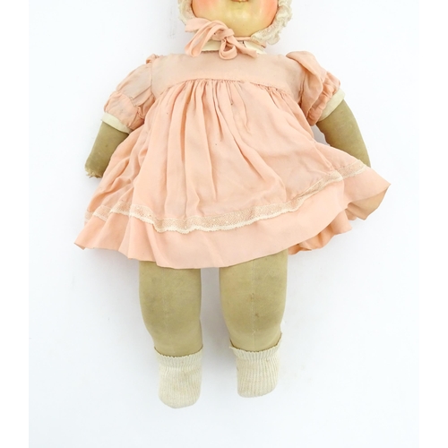 1280 - Toys: A 20thC Raynal doll with rhodoid head and cloth body. Together with a 20thC composite doll. La... 