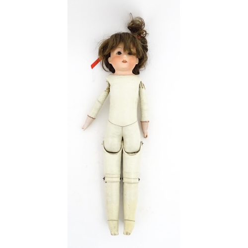 1282 - Toy: A 20thC Heubach Koppelsdorf German doll with bisque head and articulated leather body. Approx. ... 