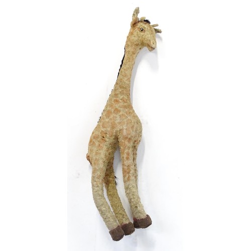 1291 - Toy: A large 20thC straw filled giraffe with glass eyes. Approx. 36 1/2