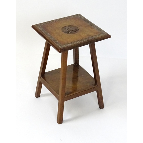 1435 - An early 20thC Anglo-Indian side table, the top with carved floral motifs to the border and Royal Ar... 