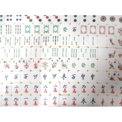 1290 - Toy: 20thC mahjong tiles and counters. The box marked Product of Mock Kee Plastic Industries, No. 17... 