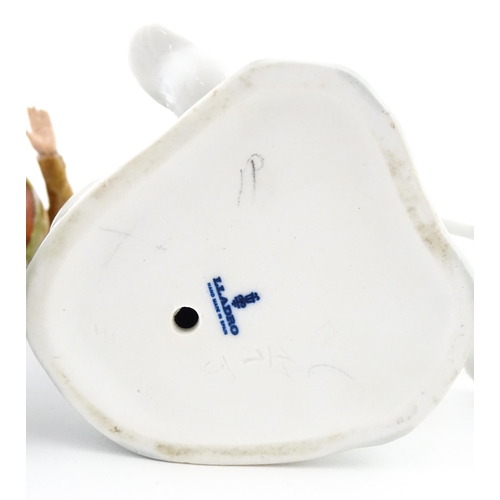 138 - A Lladro figure Girl with Geese, and a Lladro model of a goose. Together with a Capodimonte model of... 