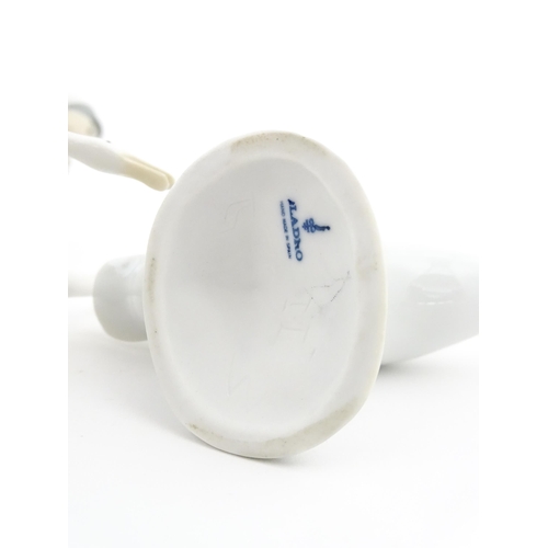 138 - A Lladro figure Girl with Geese, and a Lladro model of a goose. Together with a Capodimonte model of... 