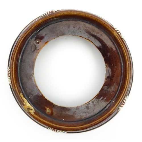 148 - A 19thC Measham bargeware teapot on stand decorated with flowers and foliage. Approx. 9 1/4