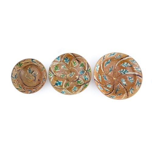 159 - Three graduated terracotta dishes decorated with stylised foliate detail. Largest approx. 12 3/4