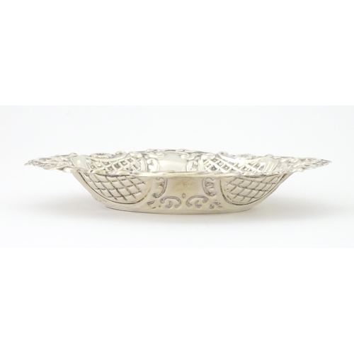 438 - A silver bon bon dish with embossed decoration, hallmarked London 1957, maker Taite & Sons. Approx. ... 