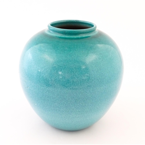 168 - A Continental vase of bulbous form with blue / turquoise glaze. Marked Serra under. Approx. 9 1/4