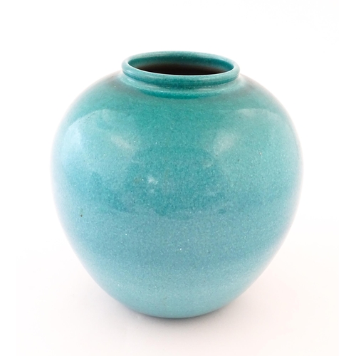 168 - A Continental vase of bulbous form with blue / turquoise glaze. Marked Serra under. Approx. 9 1/4