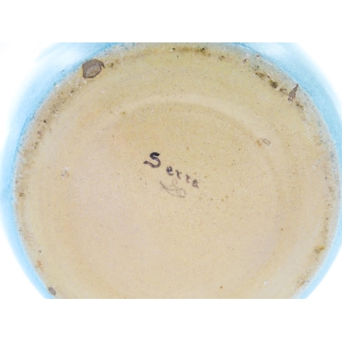 168 - A Continental vase of bulbous form with blue / turquoise glaze. Marked Serra under. Approx. 9 1/4