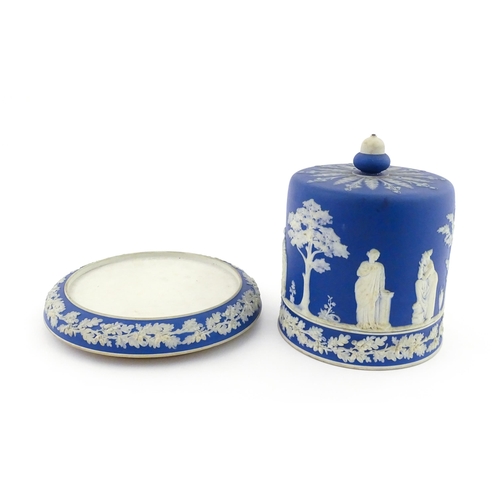 126 - A Wedgwood style jasperware cheese dish and cover / dome decorated with Classical figures / muses, a... 