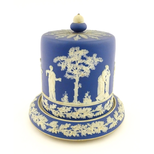 126 - A Wedgwood style jasperware cheese dish and cover / dome decorated with Classical figures / muses, a... 
