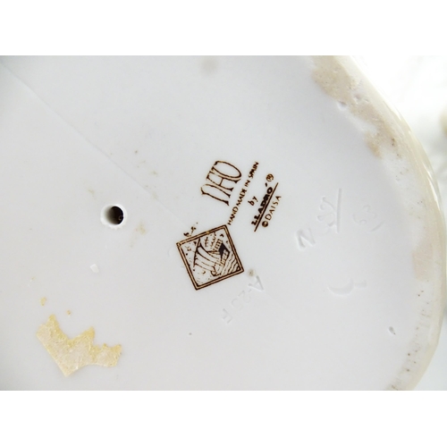 137 - Two Nao figure groups comprising Courting Couple, and two young girls with a bird on a bench. Larges... 