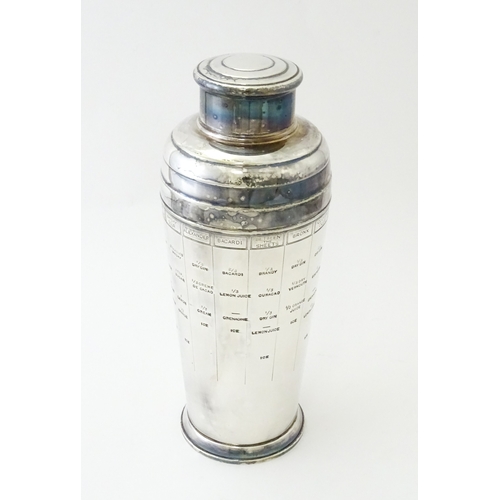 478 - A silver plate cocktail shaker with engraved cocktail recipes detail to sides. Approx. 9 3/4
