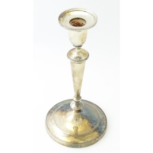 480 - A silver candlestick hallmarked Sheffield 1904, maker Thomas A Scott. Approx. 9 1/4