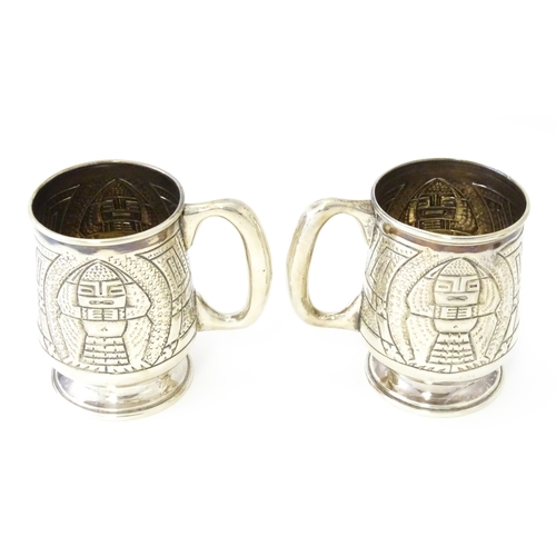483 - A pair of Columbian .900 silver tankards with engraved decoration. Approx. 5 1/2