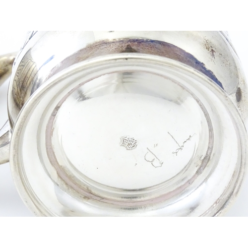 483 - A pair of Columbian .900 silver tankards with engraved decoration. Approx. 5 1/2