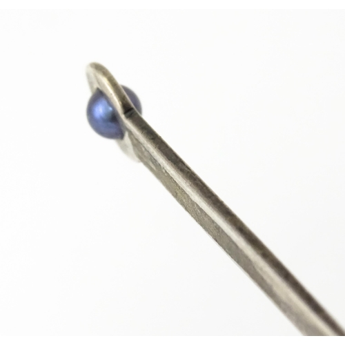 280 - A sterling silver letter opener set with blue pearl detail. Approx. 5 1/4