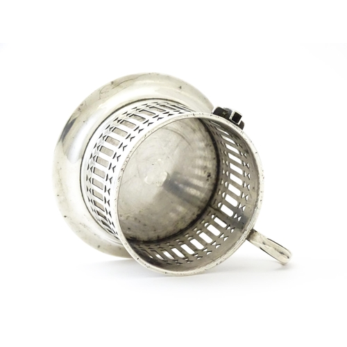 394 - A silver cup holder / sleeve with pierced detail, hallmarked Chester 1913, maker Simpson & Benzie. A... 