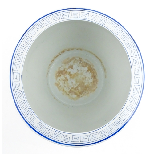 153 - An Oriental blue and white planter with floral and foliate decoration. Approx. 10