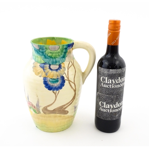 85 - A Clarice Cliff lotus jug / vase with single handle decorated in the Aurea pattern. Marked under 'Ha... 