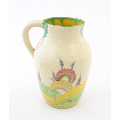 85 - A Clarice Cliff lotus jug / vase with single handle decorated in the Aurea pattern. Marked under 'Ha... 