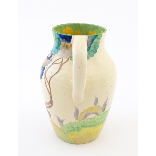 85 - A Clarice Cliff lotus jug / vase with single handle decorated in the Aurea pattern. Marked under 'Ha... 