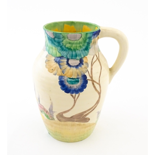 85 - A Clarice Cliff lotus jug / vase with single handle decorated in the Aurea pattern. Marked under 'Ha... 