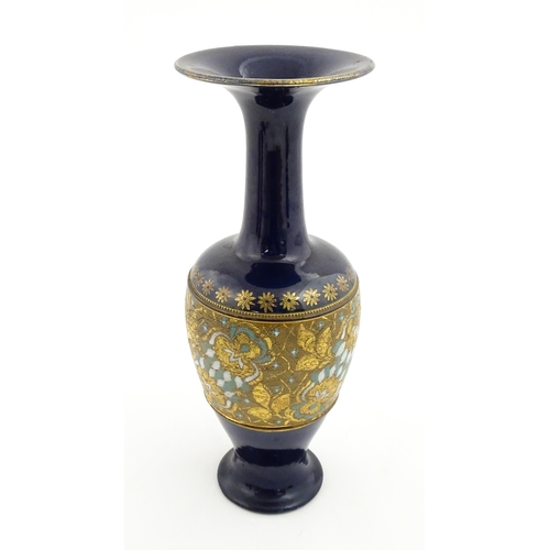 106 - A Royal Doulton vase with flared rim decorated with banded floral and foliate decoration. Marked und... 