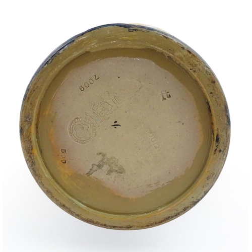 106 - A Royal Doulton vase with flared rim decorated with banded floral and foliate decoration. Marked und... 