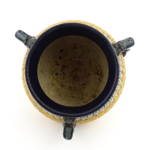 109 - A Royal Doulton stoneware gilt circle tyg of cauldron form with three mottled blue handles, banded d... 