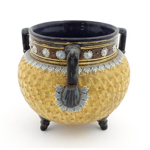 109 - A Royal Doulton stoneware gilt circle tyg of cauldron form with three mottled blue handles, banded d... 