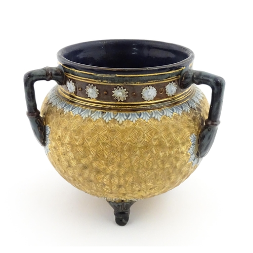 109 - A Royal Doulton stoneware gilt circle tyg of cauldron form with three mottled blue handles, banded d... 