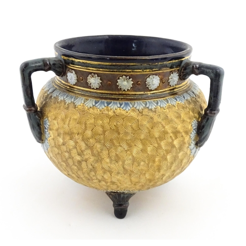 109 - A Royal Doulton stoneware gilt circle tyg of cauldron form with three mottled blue handles, banded d... 