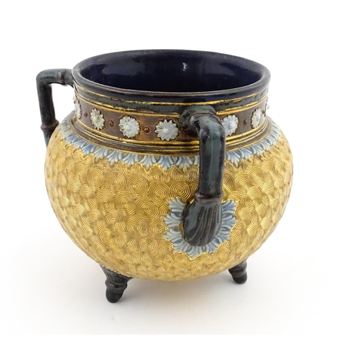 109 - A Royal Doulton stoneware gilt circle tyg of cauldron form with three mottled blue handles, banded d... 