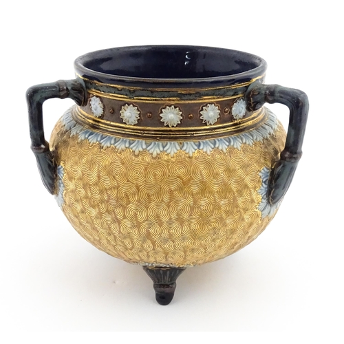 109 - A Royal Doulton stoneware gilt circle tyg of cauldron form with three mottled blue handles, banded d... 