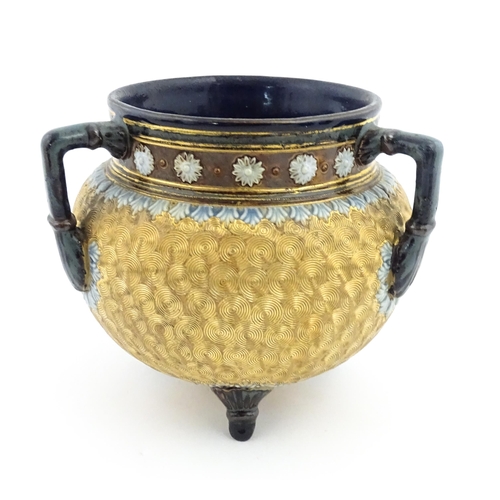 109 - A Royal Doulton stoneware gilt circle tyg of cauldron form with three mottled blue handles, banded d... 