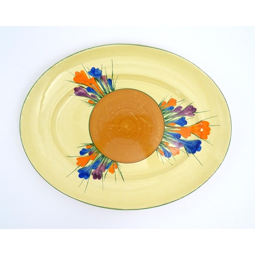 183 - Two Clarice Cliff oval serving plates decorated in the Crocus pattern. Marked under. Largest approx.... 