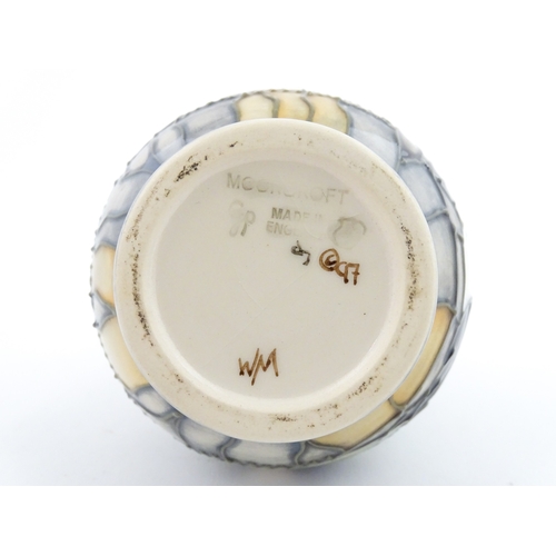 100 - A Moorcroft vase decorated in the Puffin pattern. Marked under. With box. Approx. 5 1/4