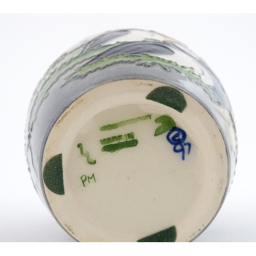 101 - A Moorcroft vase decorated in the Puffin pattern. Marked under. With box. Approx. 5 1/4