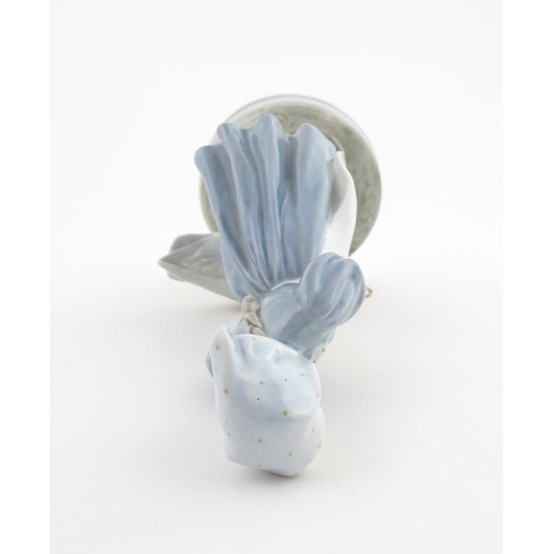 61 - A Royal Copenhagen model Girl with Goose, model no. 527. Marked under. Approx. 9