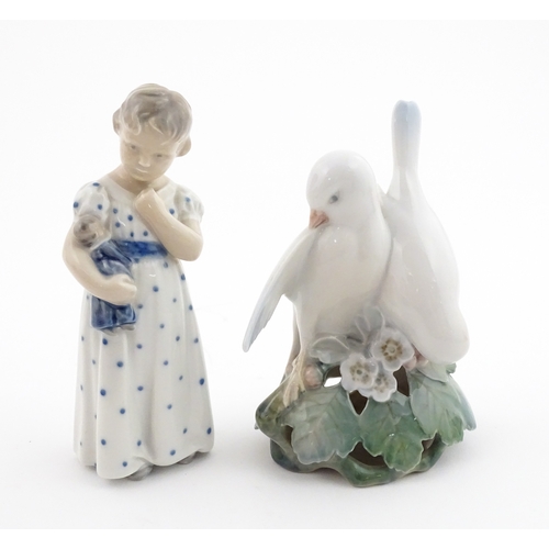 63 - Two Royal Copenhagen models comprising Girl with Doll no. 3539, and Lovebirds no. 402. Marked under.... 